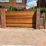 wooden and electric metal gates